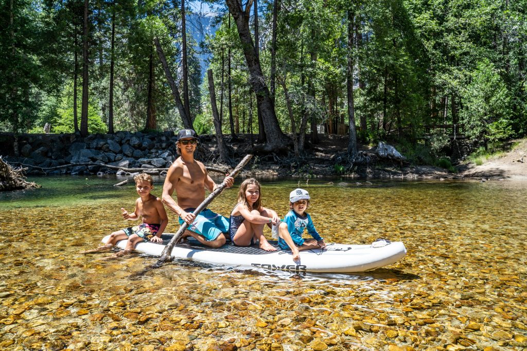 3 women and 2 men riding on boat during daytime