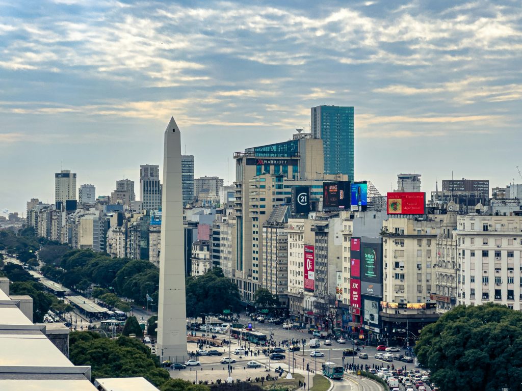 A view of a city with tall buildings and a obelisk