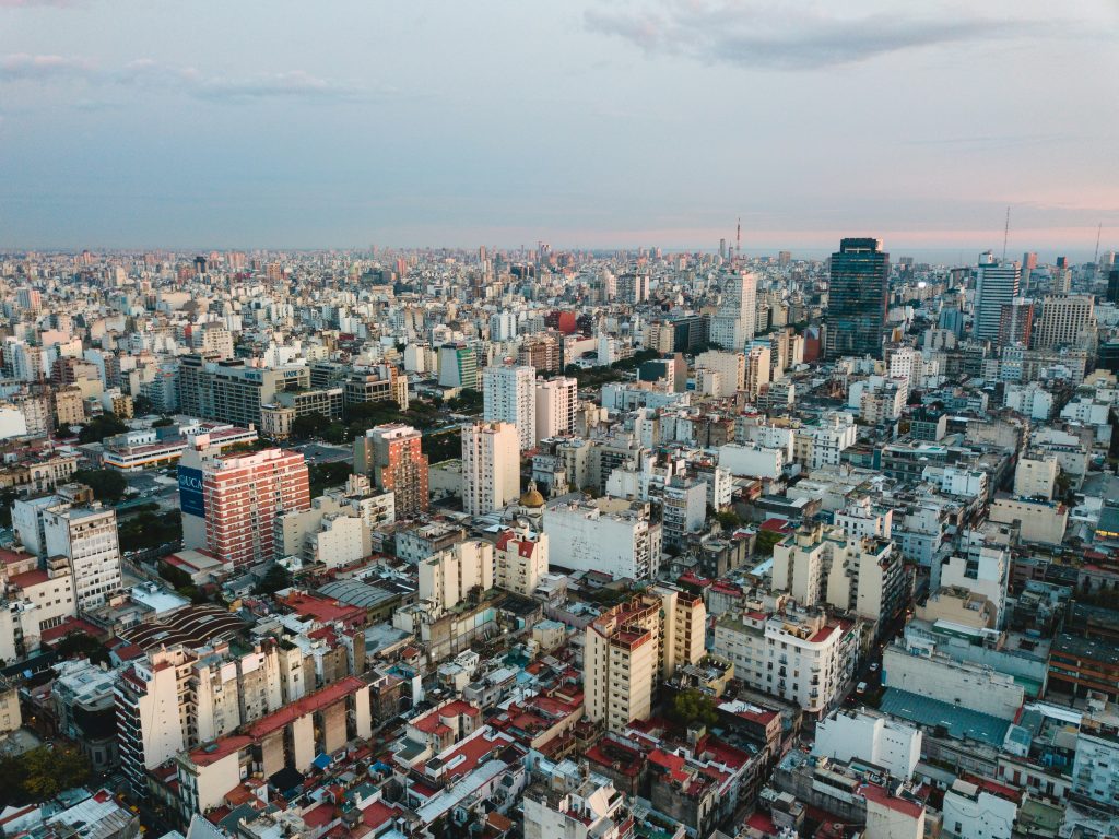 aerial view of city under cloudy sky during daytime