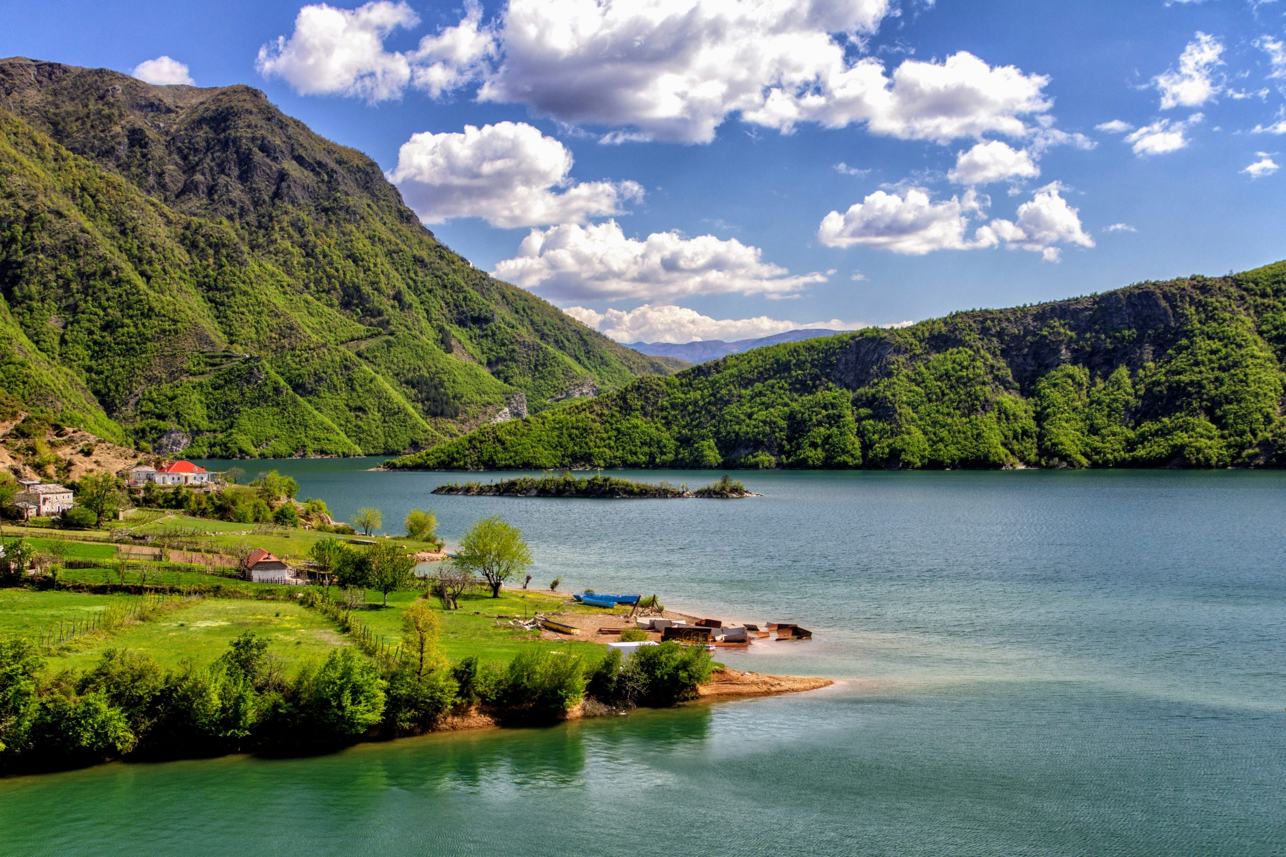 houses near body of water during daytime