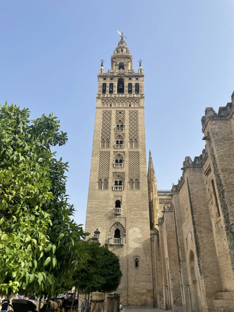 a tall tower with a clock on the top of it