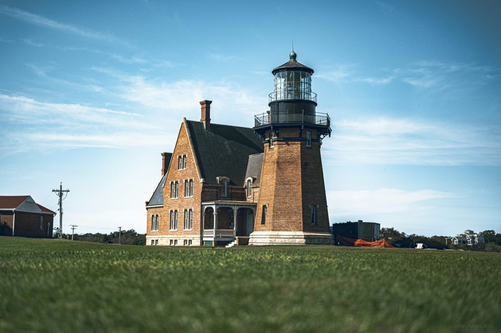 a large brick building with a light house on top of it