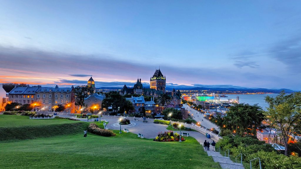 a scenic view of a city at dusk