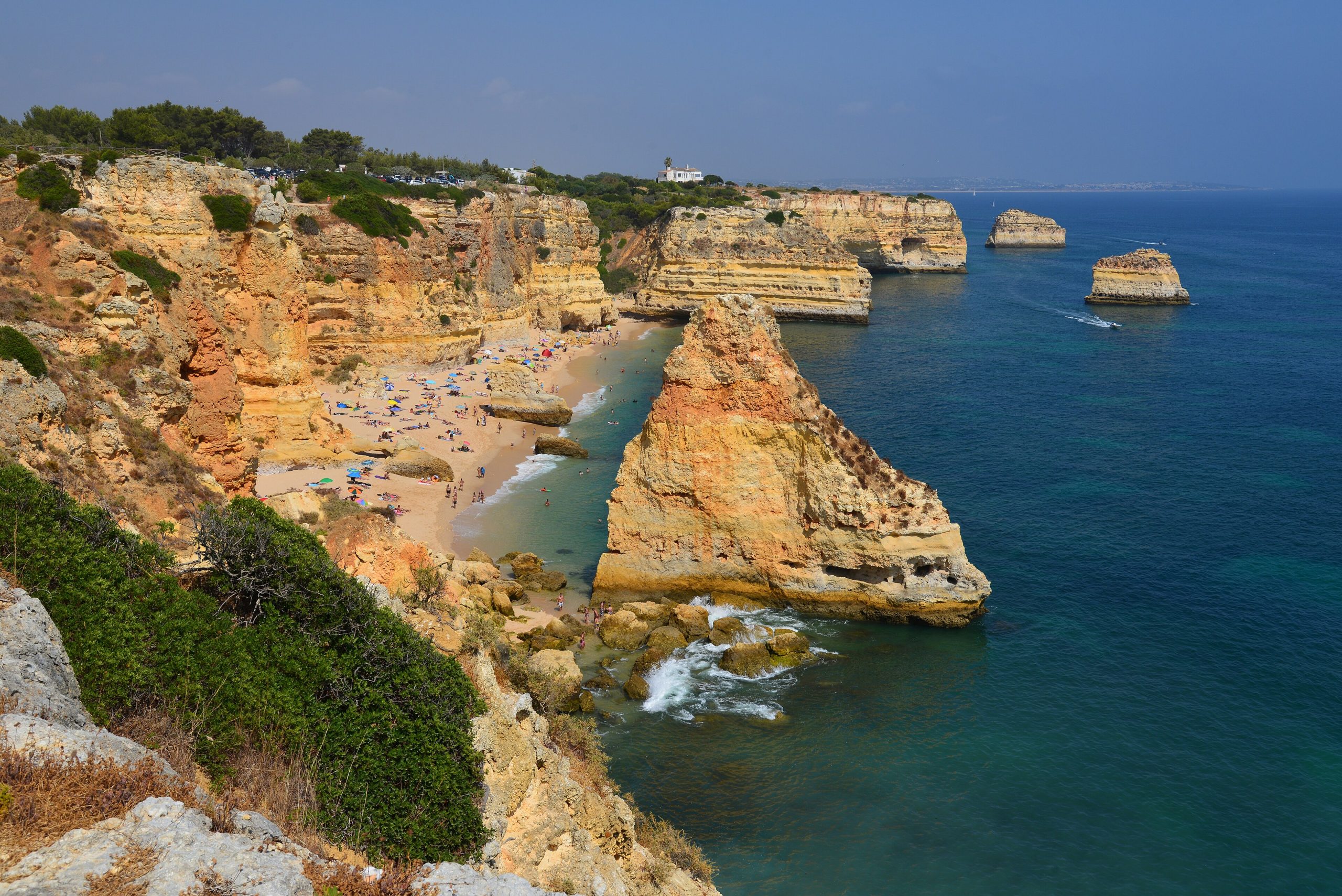 Golden limestone cliffs above a cove beach in the Algarve, Portugal