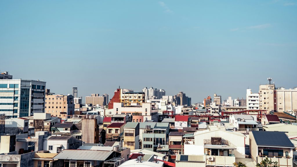city buildings under blue sky during daytime