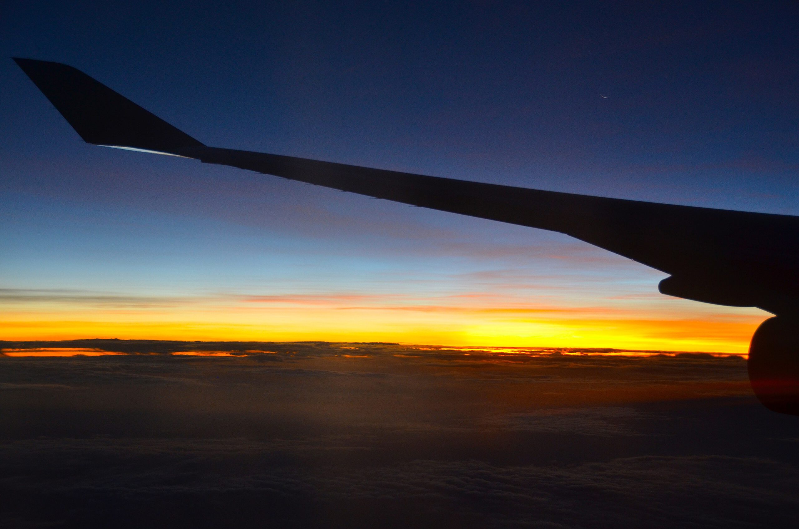View from an airplane window at sunset