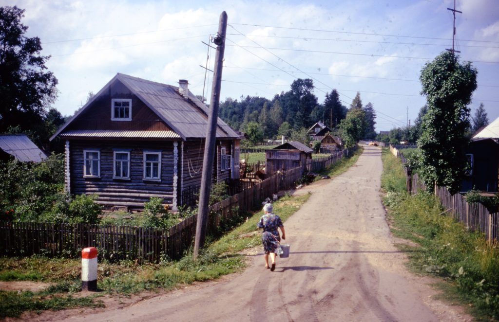 woman holding man and toddler hands during daytime