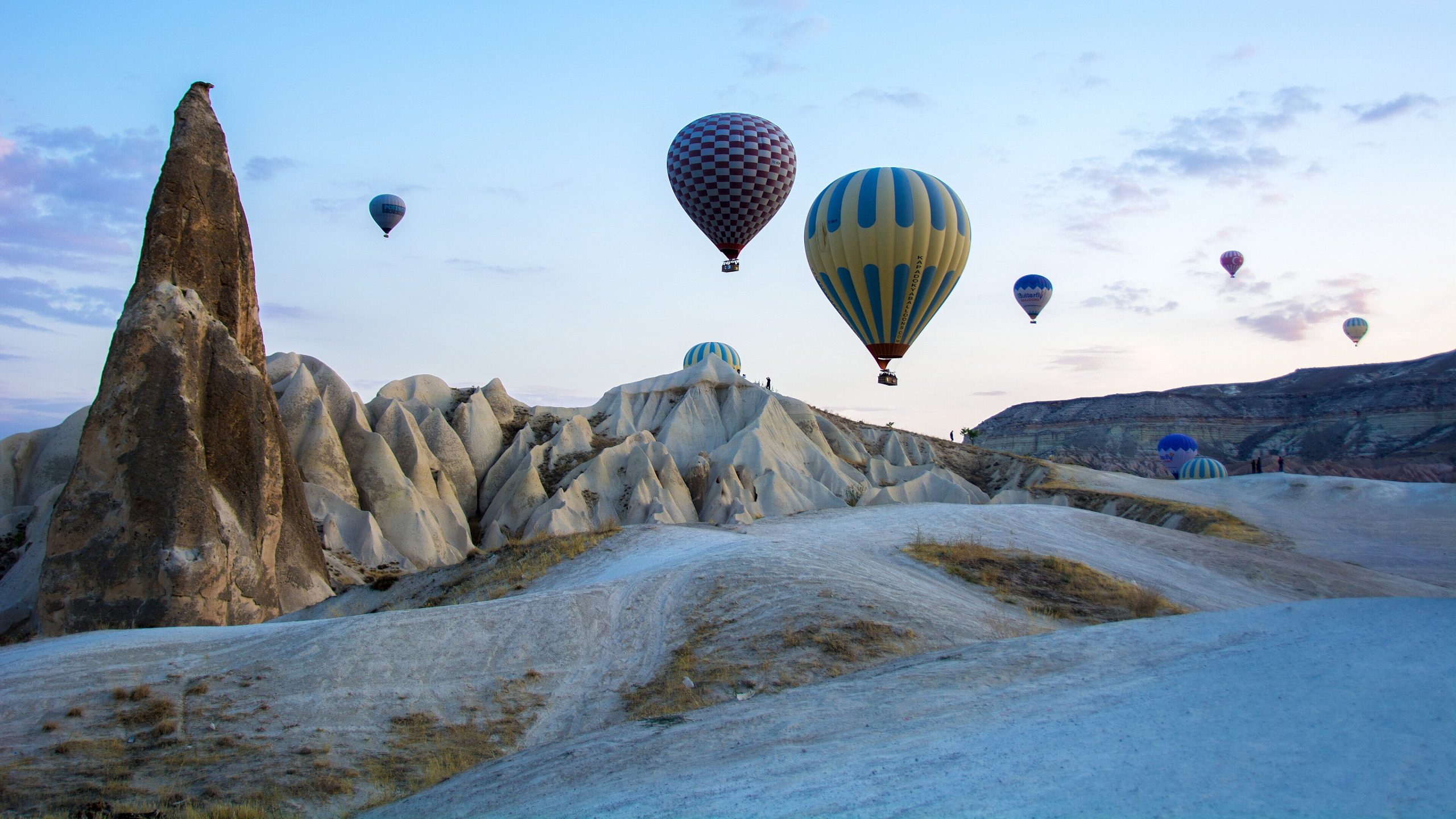 Hot-air balloons rising over the fairy chimneys of Göreme, Cappadocia, at dawn
